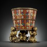 AN IMPERIAL CLOISONNÉ ENAMEL JARDINIÈRE, SUPPORTED BY THREE GILT-BRONZE KNEELING BOYS FEET,QIANLONG