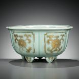 A MOLDED, LOBED AND GILT CELADON-GLAZED JARDINIERE, QIANLONG MARK AND PERIOD