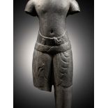 A GRAY SANDSTONE TORSO OF A MALE DEITY, ANGKOR PERIOD, BAPHUON STYLE