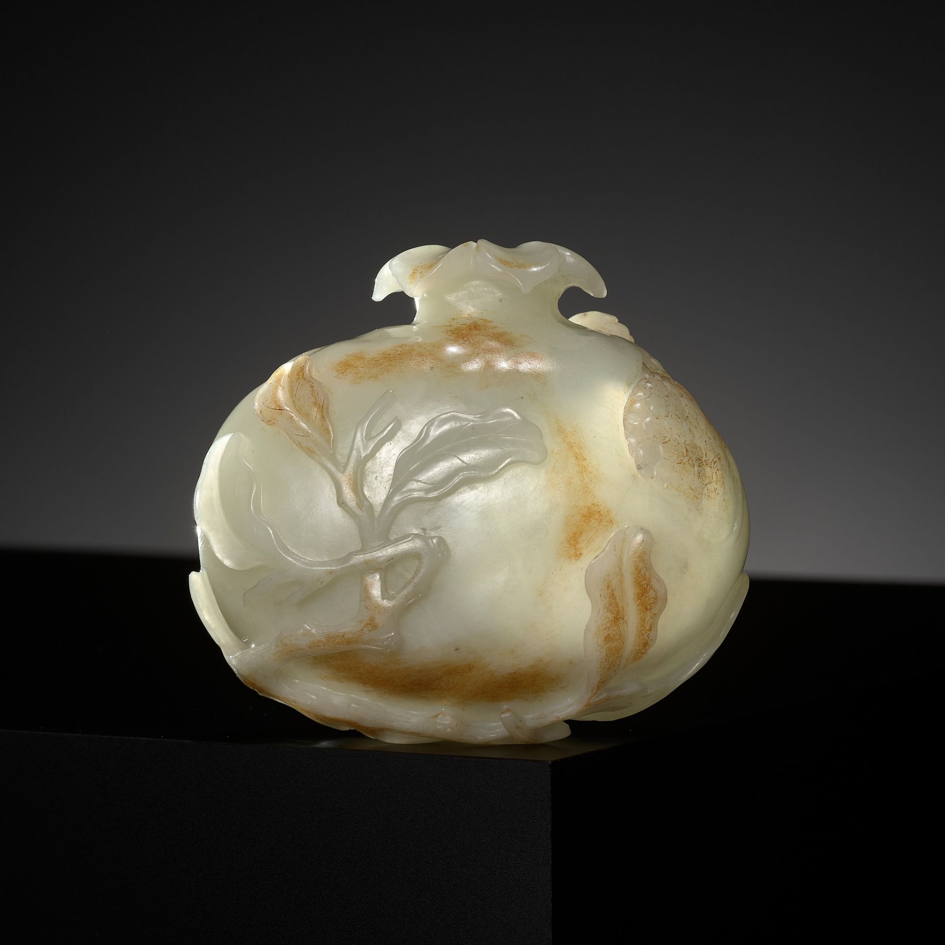 A PALE CELADON AND RUSSET JADE 'CICADA AND POMEGRANATE' WATER POT, CHINA, 18TH CENTURY