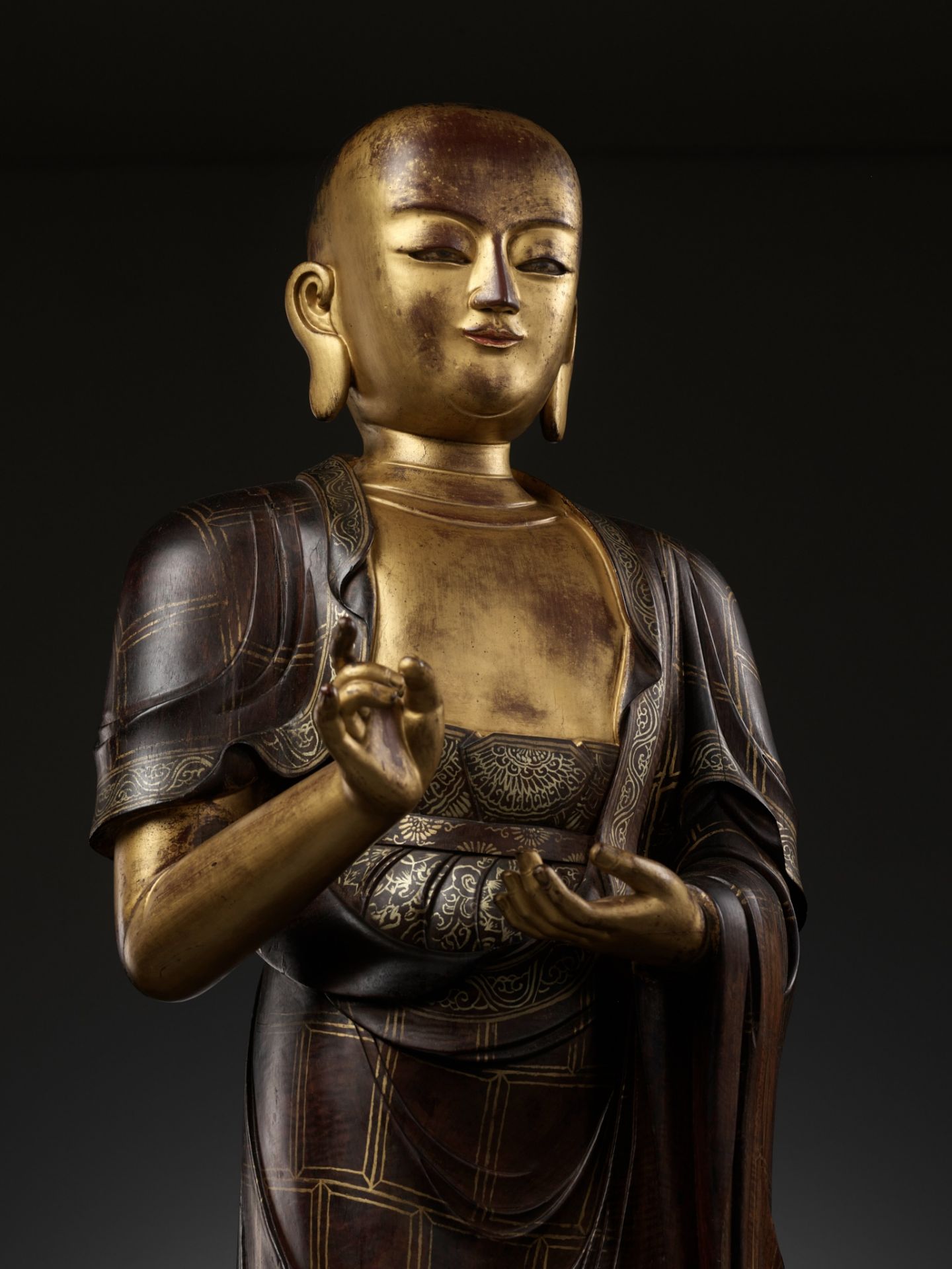 A LARGE AND HIGHLY IMPORTANT ZITAN AND GILT-LACQUERED STATUE OF SARIPUTRA, THE FIRST OF BUDDHA'S TWO