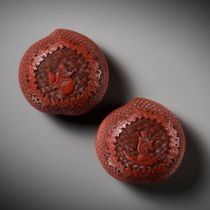 A PAIR OF HEAVY CARVED CINNABAR LACQUER PEACH-FORM BOXES AND COVERS DEPICTING IMMORTALS, QIANLONG