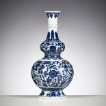 A BLUE AND WHITE DOUBLE GOURD VASE, QIANLONG MARK, CHINA, 19TH CENTURY