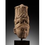 A PINK SANDSTONE HEAD OF VISHNU, INDIA, RAJASTHAN OR MADHYA PRADESH, 11TH-12TH CENTURY