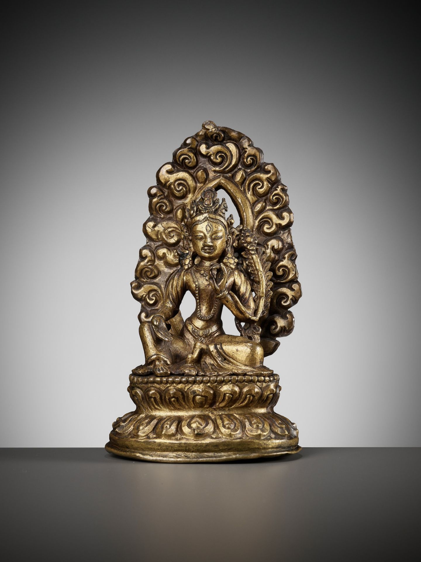 A GILT COPPER REPOUSSE FIGURE OF TARA, NEPAL, 18TH-19TH CENTURY - Image 13 of 15