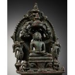 A SILVER-INLAID AND INSCRIBED BRONZE SHRINE, JAIN, WESTERN INDIA, CIRCA 10TH - 11TH CENTURY