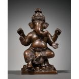 A COPPER ALLOY FIGURE OF GANESHA, SOUTH INDIA, 18TH CENTURY