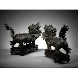 A PAIR OF HEAVY BRONZE FIGURES OF QILIN, MING DYNASTY