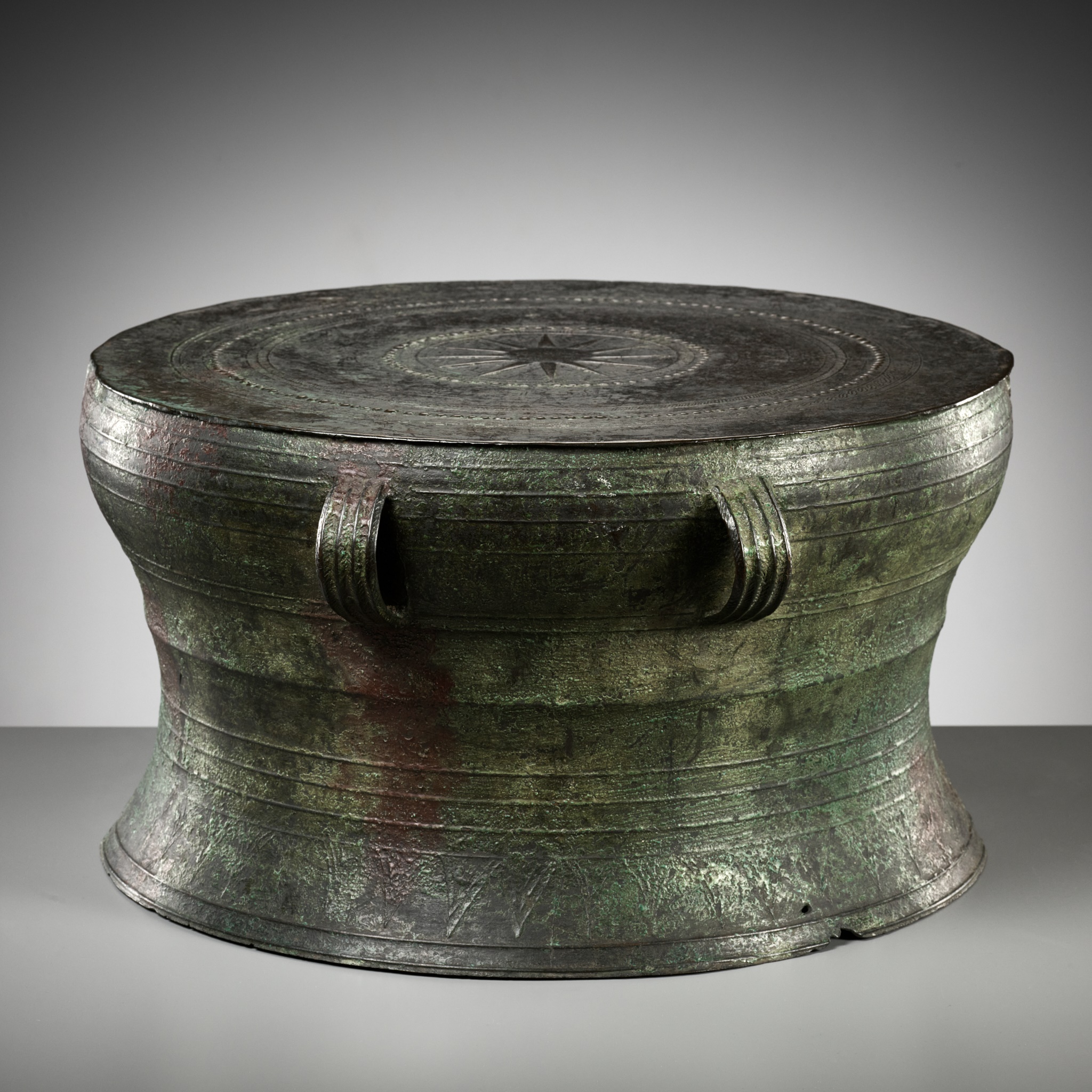 A LARGE AND HEAVY BRONZE RAIN DRUM, DONG SON CULTURE
