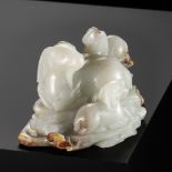 A WHITE AND RUSSET JADE 'SANYANG AND LINGZHI' GROUP, QING DYNASTY