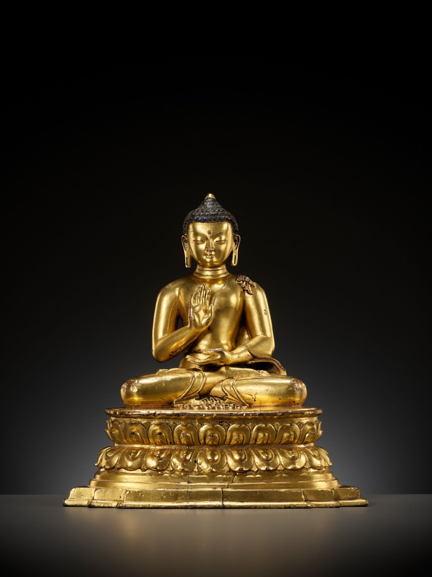 A GILT COPPER ALLOY FIGURE OF AMOGHASIDDHI, POSSIBLY DENSATIL, TIBET, 14TH-15TH CENTURY - Image 2 of 22