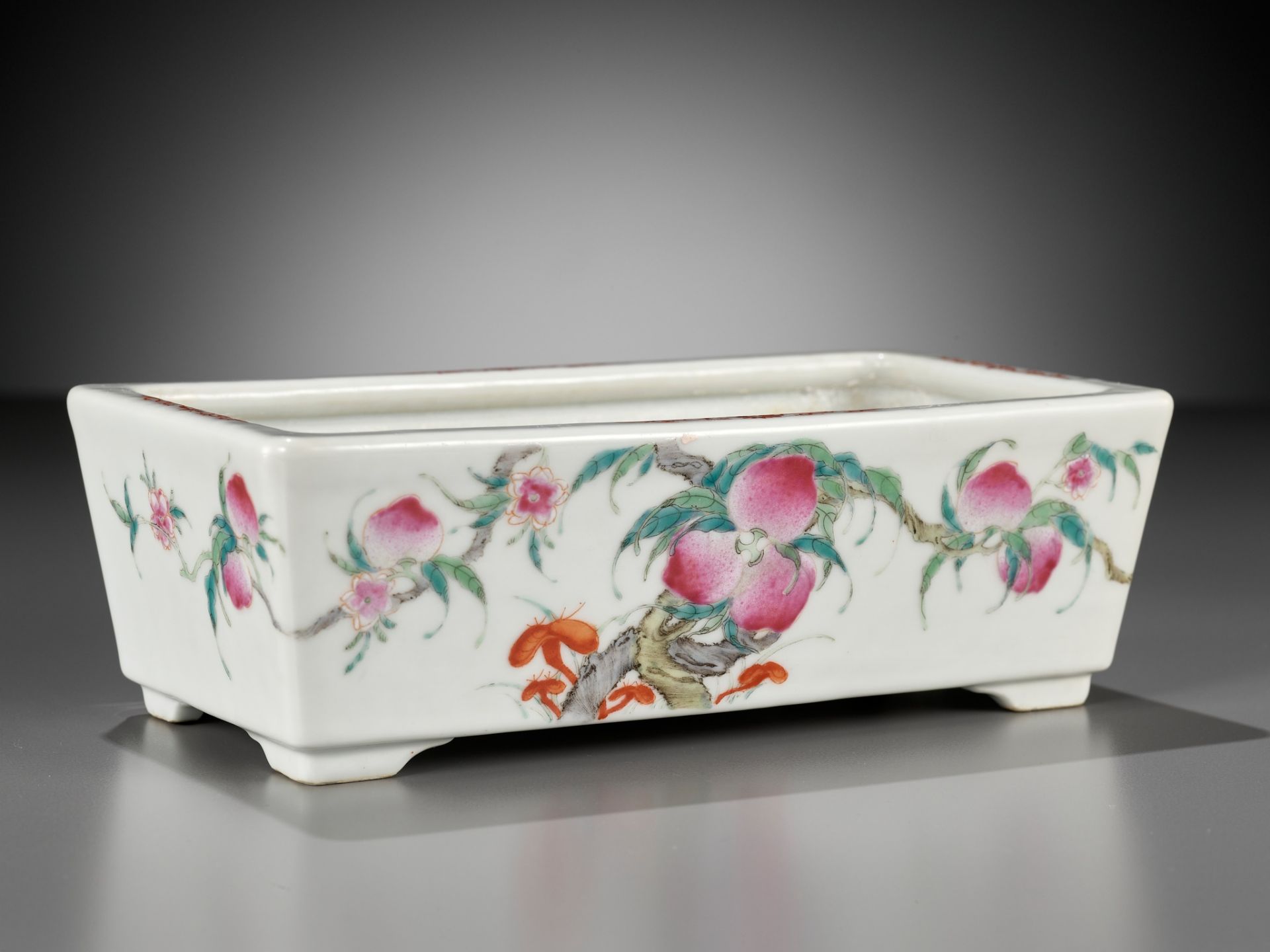 A FAMILLE ROSE 'NINE PEACHES' JARDINIERE, GUANGXU MARK AND PROBABLY OF THE PERIOD
