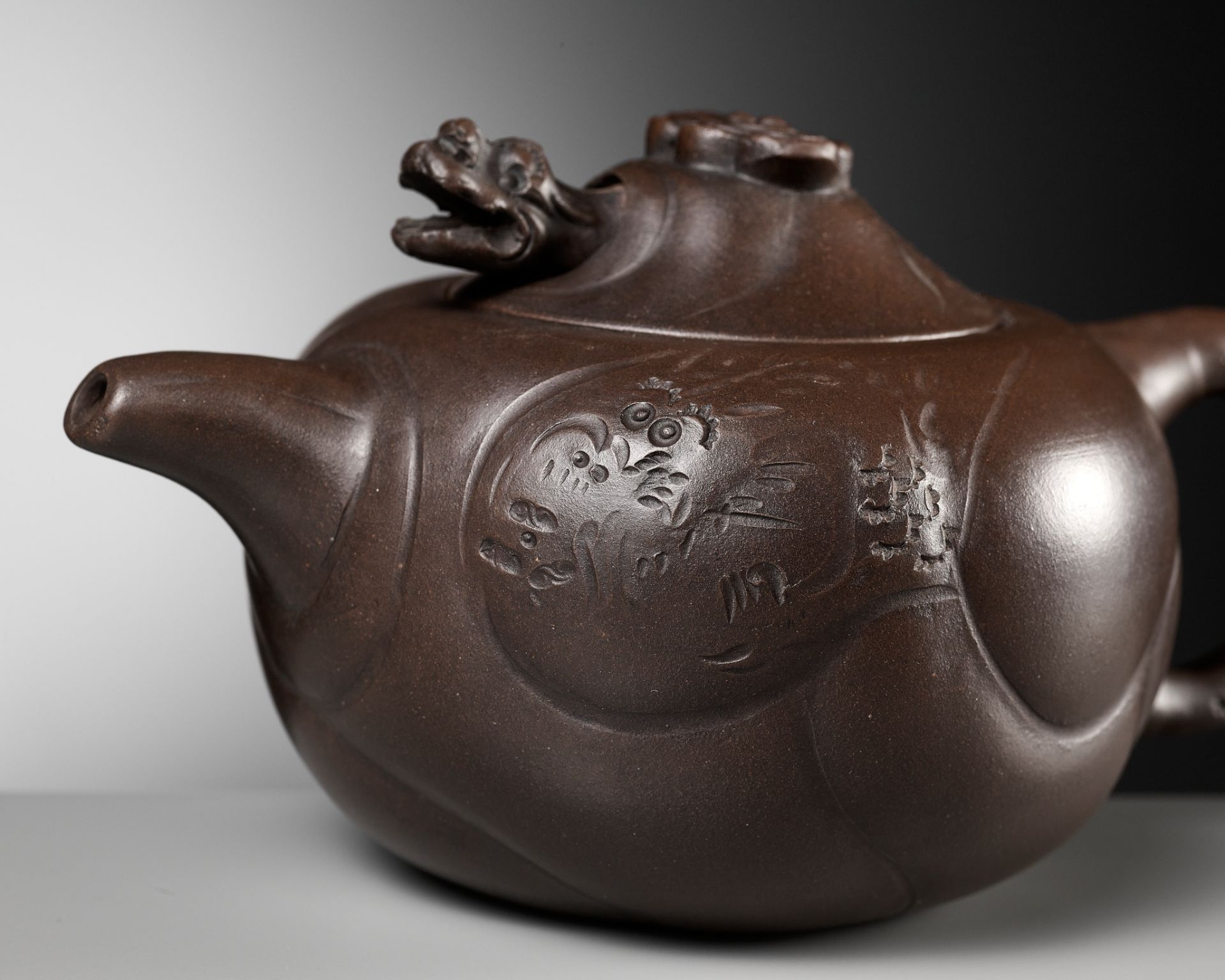 A YIXING STONEWARE 'DRAGON AND CARP' TEAPOT AND COVER, BY WANG YUYING, REPUBLIC PERIOD