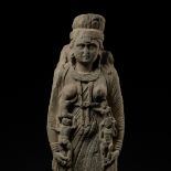 A MONUMENTAL SCHIST FIGURE OF THE GODDESS HARITI, ANCIENT REGION OF GANDHARA