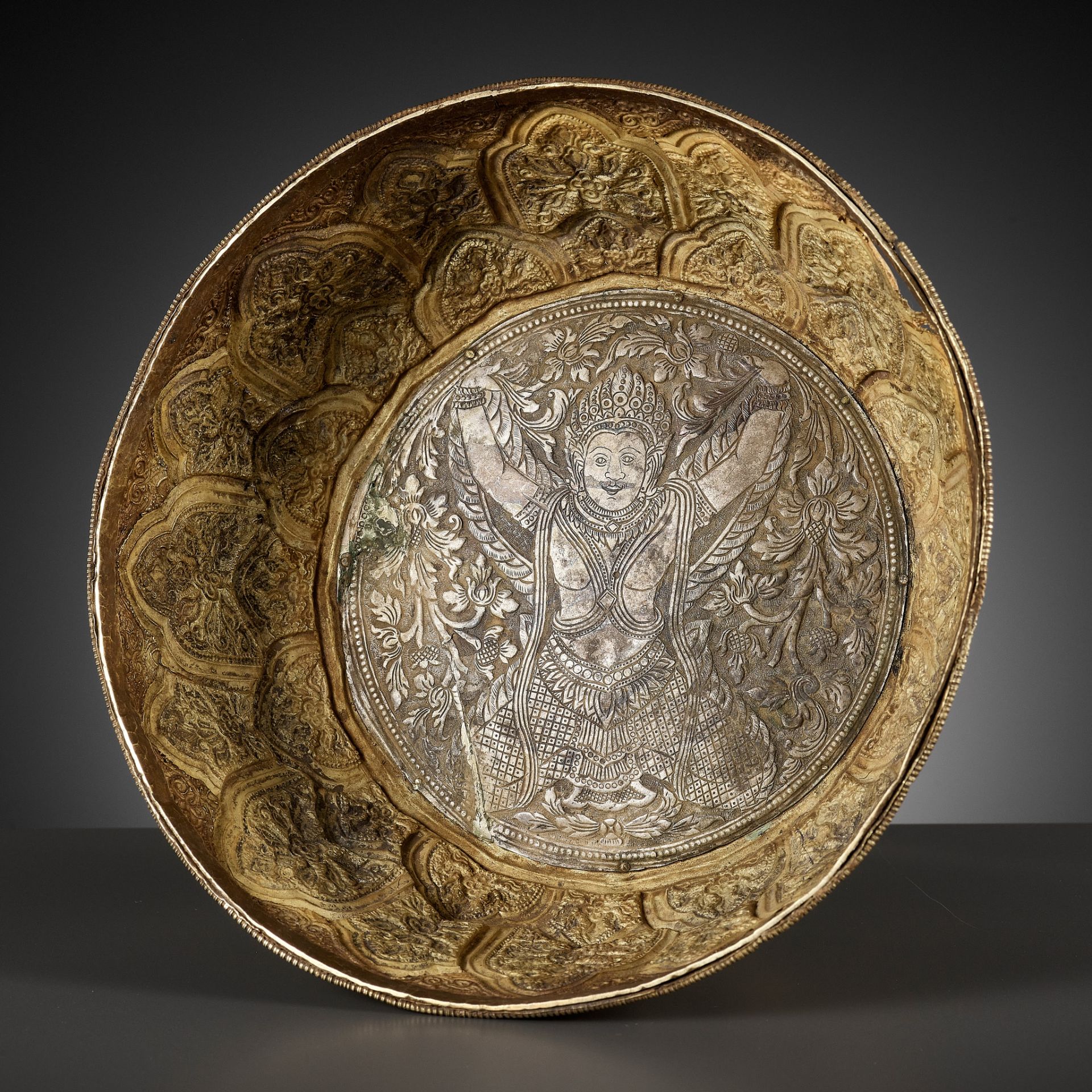 A SILVER-INLAID GOLD REPOUSSÉ BOWL DEPICTING GARUDA, VIETNAM,FORMER KINGDOMS OF CHAMPA,CIRCA 10TH C.