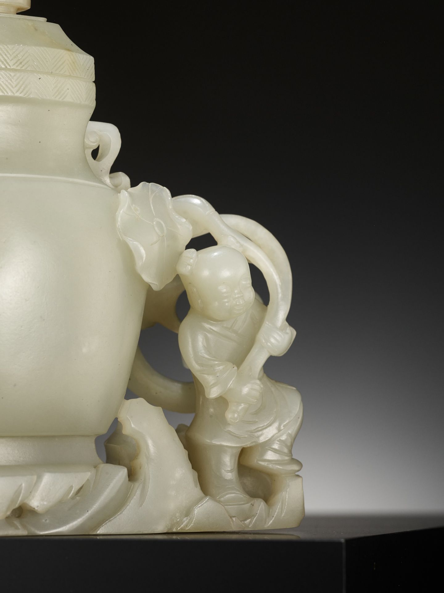 A CELADON JADE 'BOY AND CHILONG' VASE AND COVER, LATE QING TO REPUBLIC PERIOD - Image 11 of 12