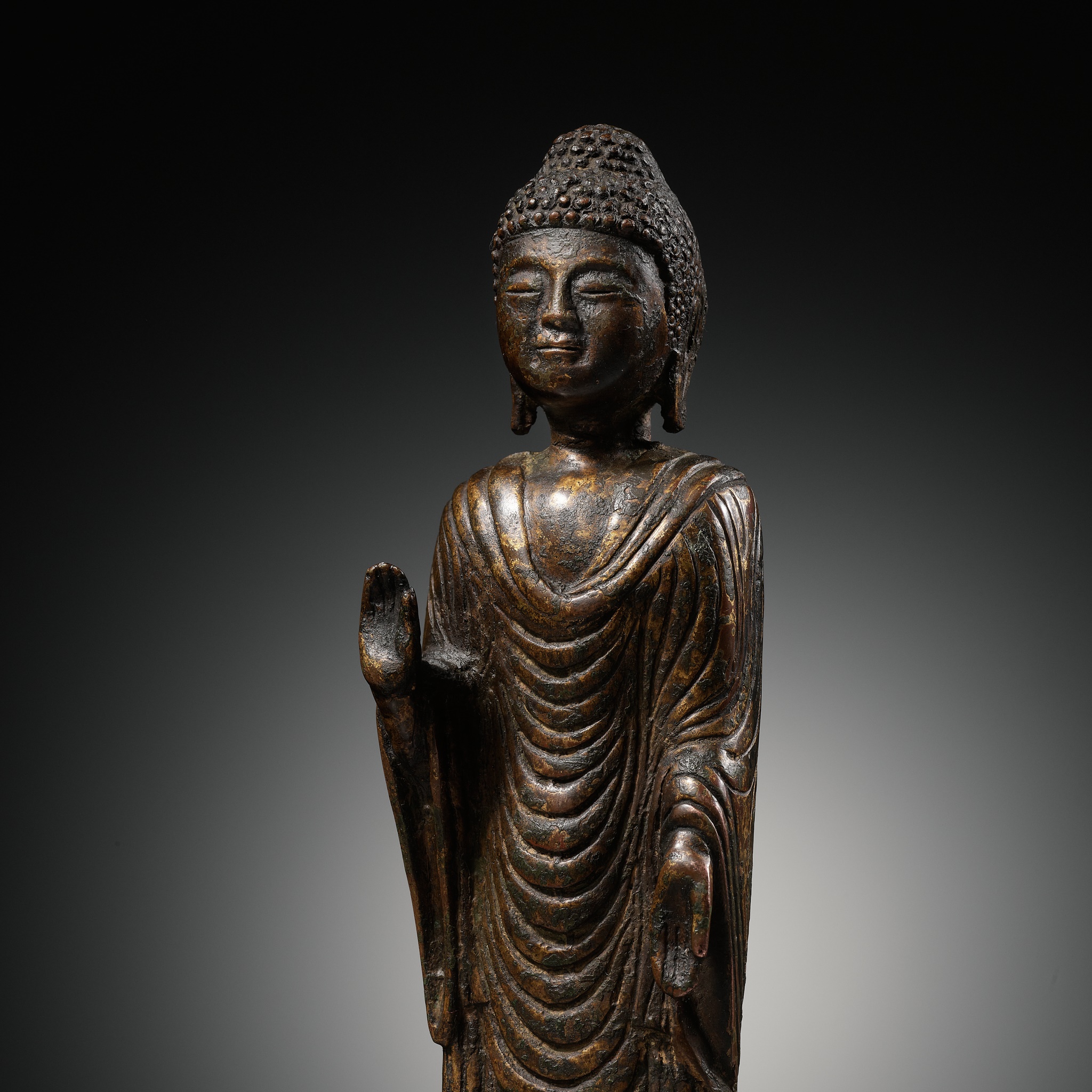 A GILT-BRONZE STANDING FIGURE OF BUDDHA, UNIFIED SILLA DYNASTY, KOREA, 8TH - 9TH CENTURY
