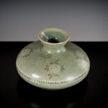 A SLIP-INLAID AND CELADON-GLAZED STONEWARE OIL BOTTLE, GORYEO DYNASTY