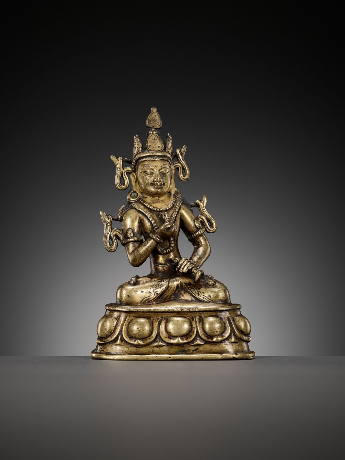 A GILT-BRONZE AND TURQUOISE-INLAID FIGURE OF VAJRASATTVA, KASHMIR STYLE, WEST TIBET, 12TH CENTURY - Image 9 of 10