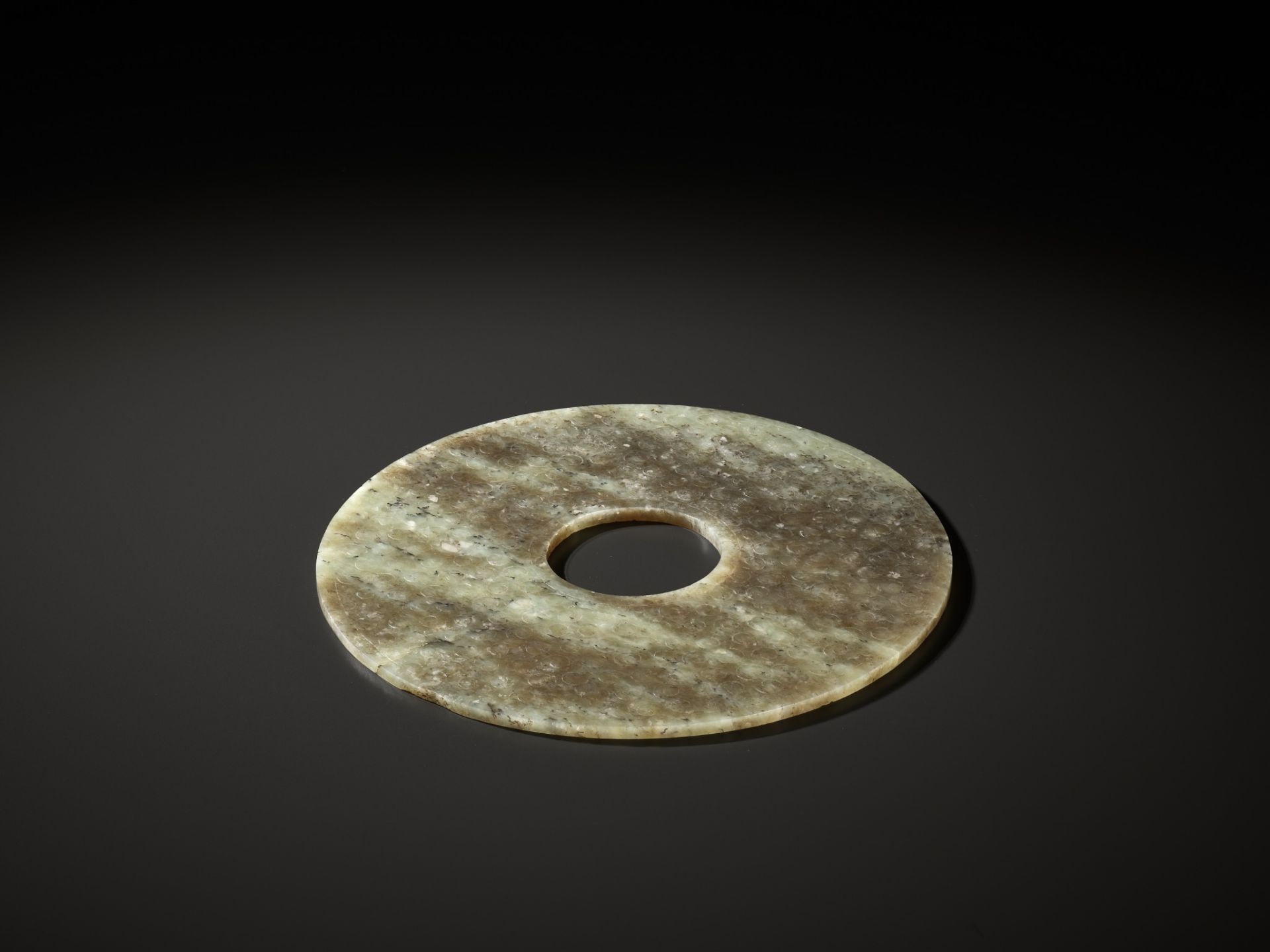 A CELADON AND BROWN JADE BI DISK, EASTERN ZHOU TO WARRING STATES PERIOD - Image 12 of 16