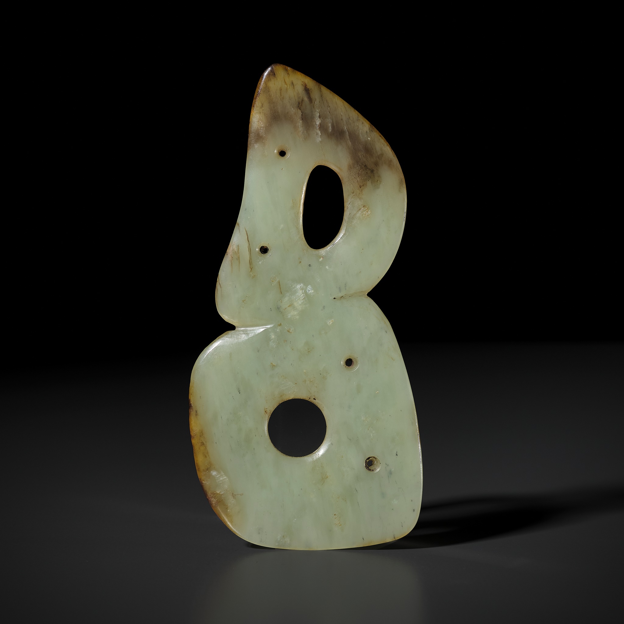 A PALE YELLOW JADE DOUBLE-HOLE ORNAMENT PLAQUE, HONGSHAN CULTURE
