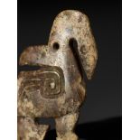 A 'TWO-FACE' JADE PENDANT DEPICTING A MYTHICAL WATERBIRD, LATE SHANG TO WESTERN ZHOU DYNASTY