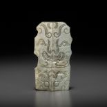 A JADE 'TAOTIE MASK' ORNAMENT, ZHOU DYNASTY