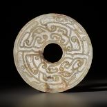 A JADE 'DRAGON' BI DISK, WESTERN ZHOU DYNASTY