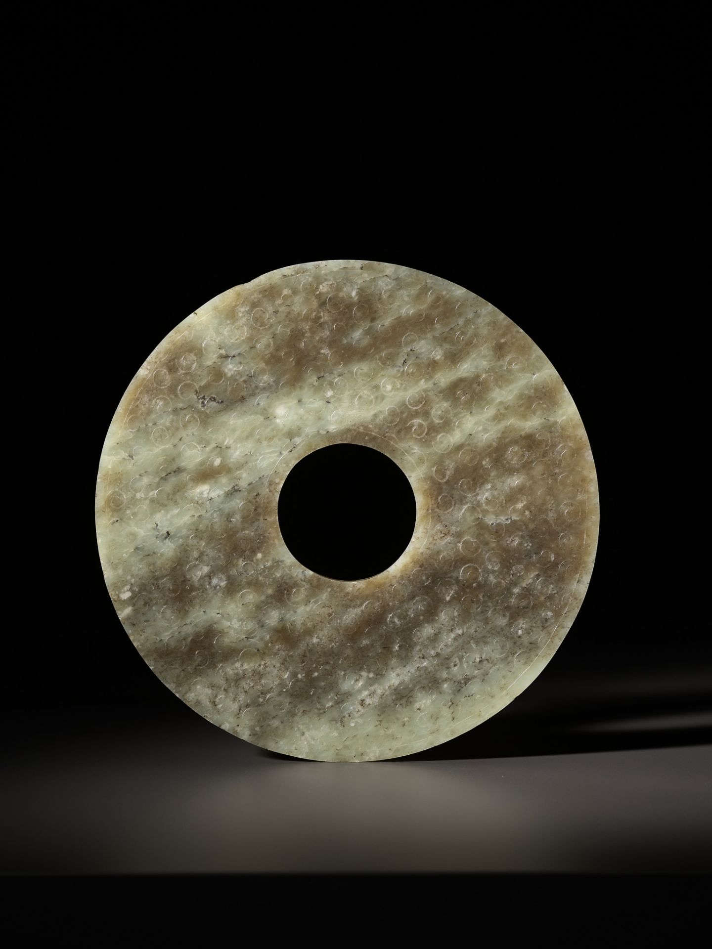 A CELADON AND BROWN JADE BI DISK, EASTERN ZHOU TO WARRING STATES PERIOD - Image 8 of 16