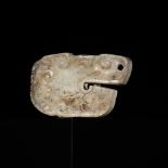 A SMALL JADE 'DRAGON HEAD' PENDANT, WARRING STATES PERIOD