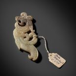 A SUPERB CELADON AND BROWN JADE 'DRAGON' PENDANT, WESTERN HAN DYNASTY