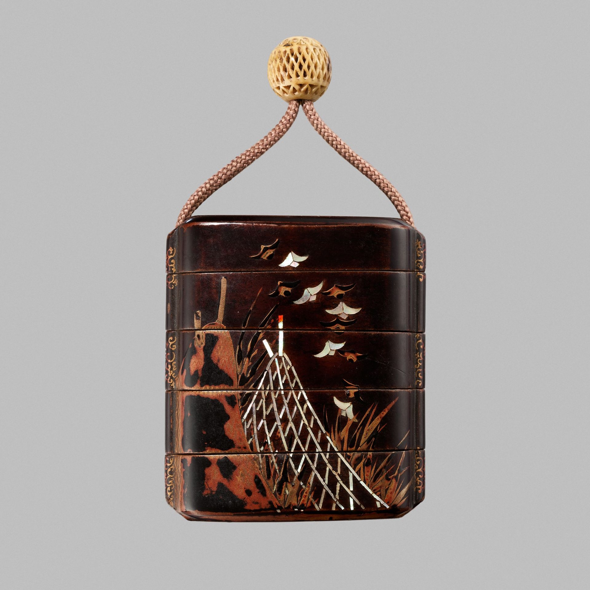 A FINE FOUR-CASE INRO DEPICTING BIRDS IN FLIGHT ABOVE NETS AND FISH TRAPS