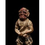 A RARE POLYCHROME WOOD FIGURE OF AN ONI WITH SNAKE, LATE MUROMACHI TO EARLY EDO