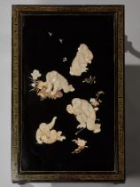 A FINE ANTLER AND MOTHER-OF-PEARL INLAID BLACK-LACQUER LOW TABLE WITH FROLICKING MONKEYS