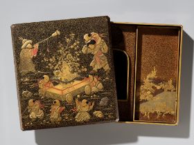 A LACQUER SUZURIBAKO DEPICTING BOYS AT PLAY
