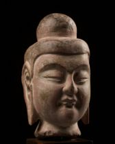 A SANDSTONE HEAD OF BUDDHA, NORTHERN WEI DYNASTY
