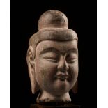 A SANDSTONE HEAD OF BUDDHA, NORTHERN WEI DYNASTY