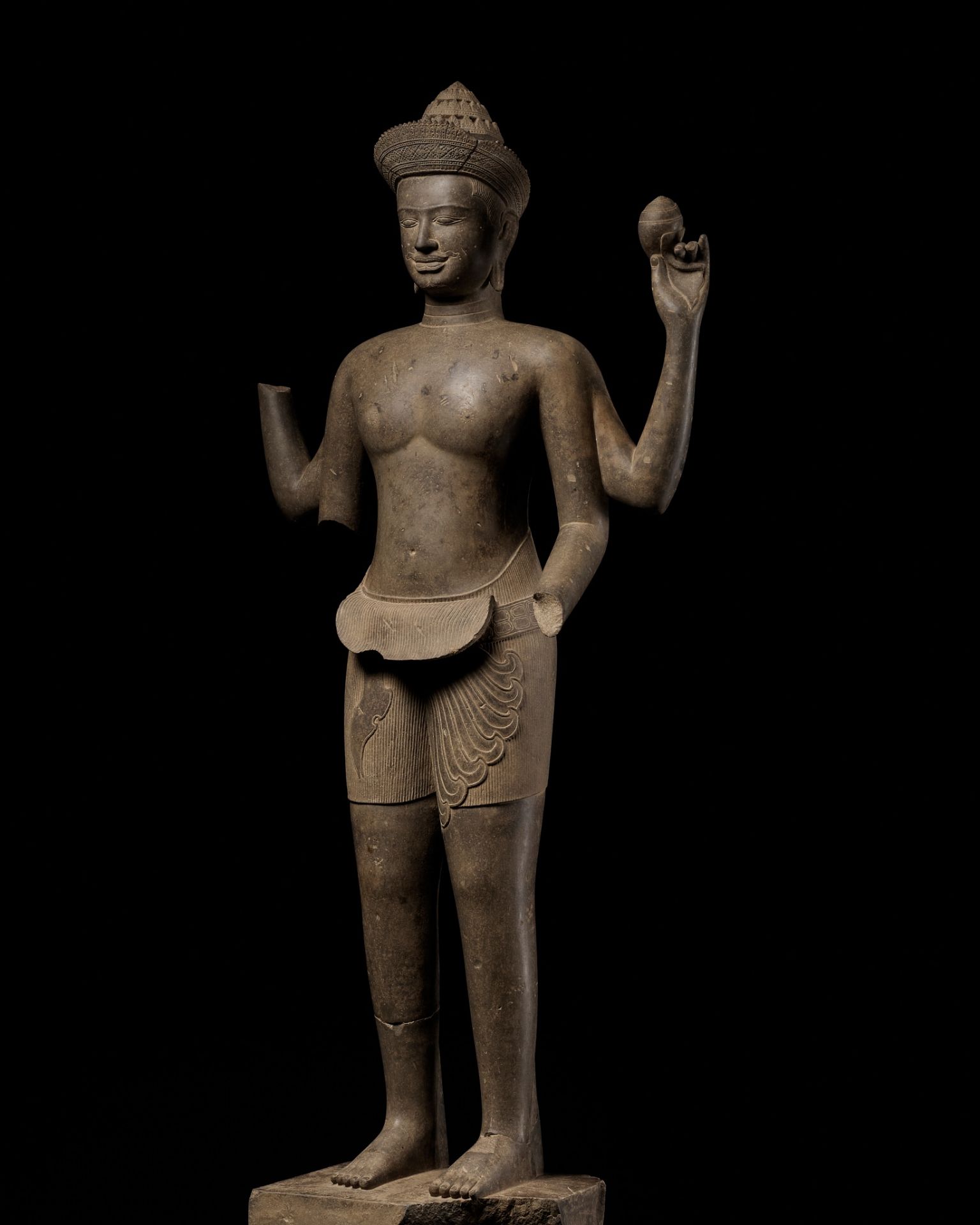 AN EXTREMELY RARE AND MONUMENTAL SANDSTONE STATUE OF VISHNU, ANGKOR PERIOD