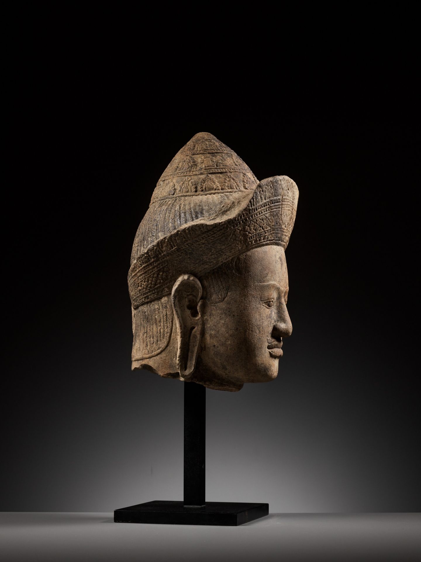 A LARGE SANDSTONE HEAD OF A MALE DEITY, ANGKOR PERIOD, KHLEANG STYLE - Image 11 of 11