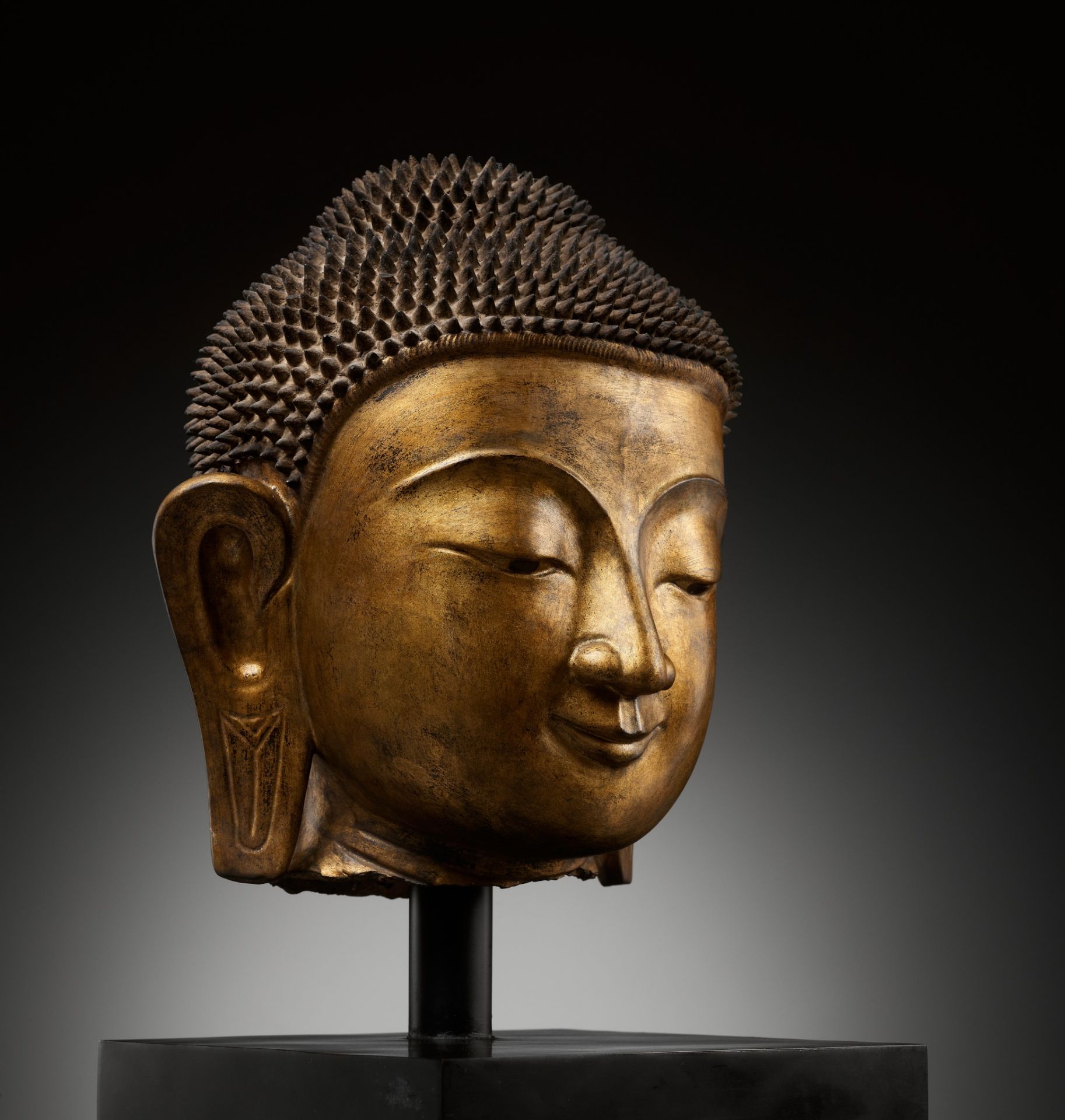 A LARGE GILT DRY LACQUER HEAD OF BUDDHA, SHAN STYLE, BURMA, 19TH CENTURY