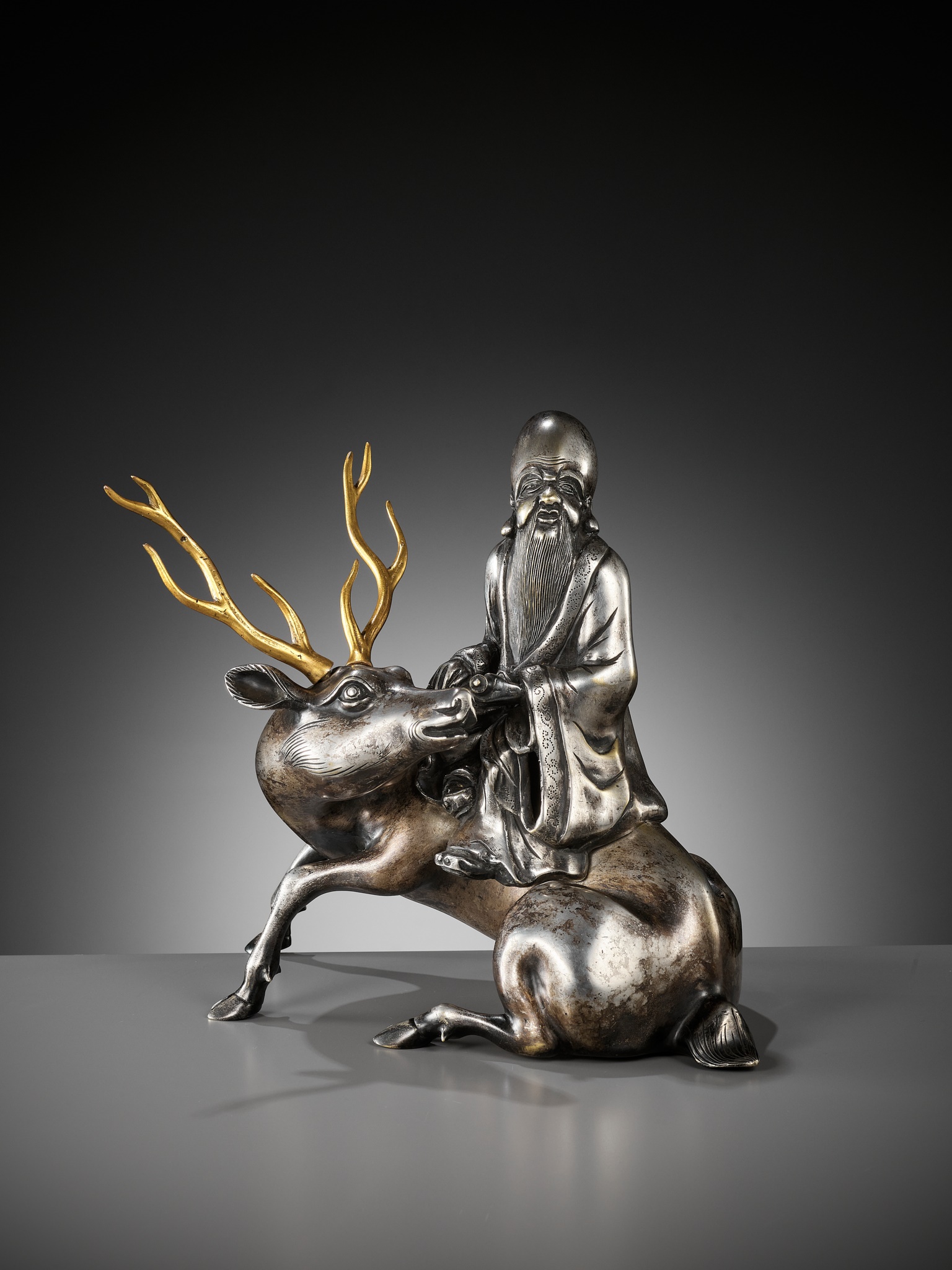 A SILVERED AND GILT BRONZE 'SHOULAO AND DEER' INCENSE BURNER, QING DYNASTY - Image 6 of 14
