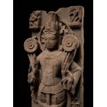 A MONUMENTAL SANDSTONE STELE OF SURYA, NORTHERN INDIA, UTTAR PRADESH, 11TH-12TH CENTURY