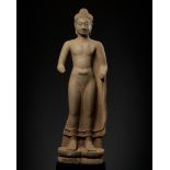 A MONUMENTAL AND HIGHLY IMPORTANT SANDSTONE FIGURE OF BUDDHA, PRE-ANGKOR PERIOD
