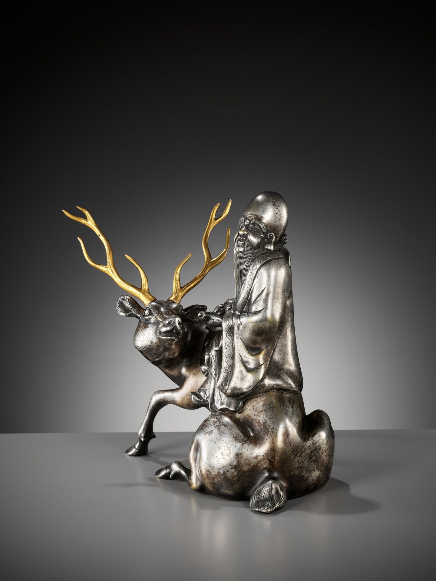 A SILVERED AND GILT BRONZE 'SHOULAO AND DEER' INCENSE BURNER, QING DYNASTY - Image 7 of 14