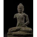 A VOLCANIC STONE FIGURE OF BUDDHA, CENTRAL JAVA, INDONESIA, FIRST HALF OF THE 9TH CENTURY