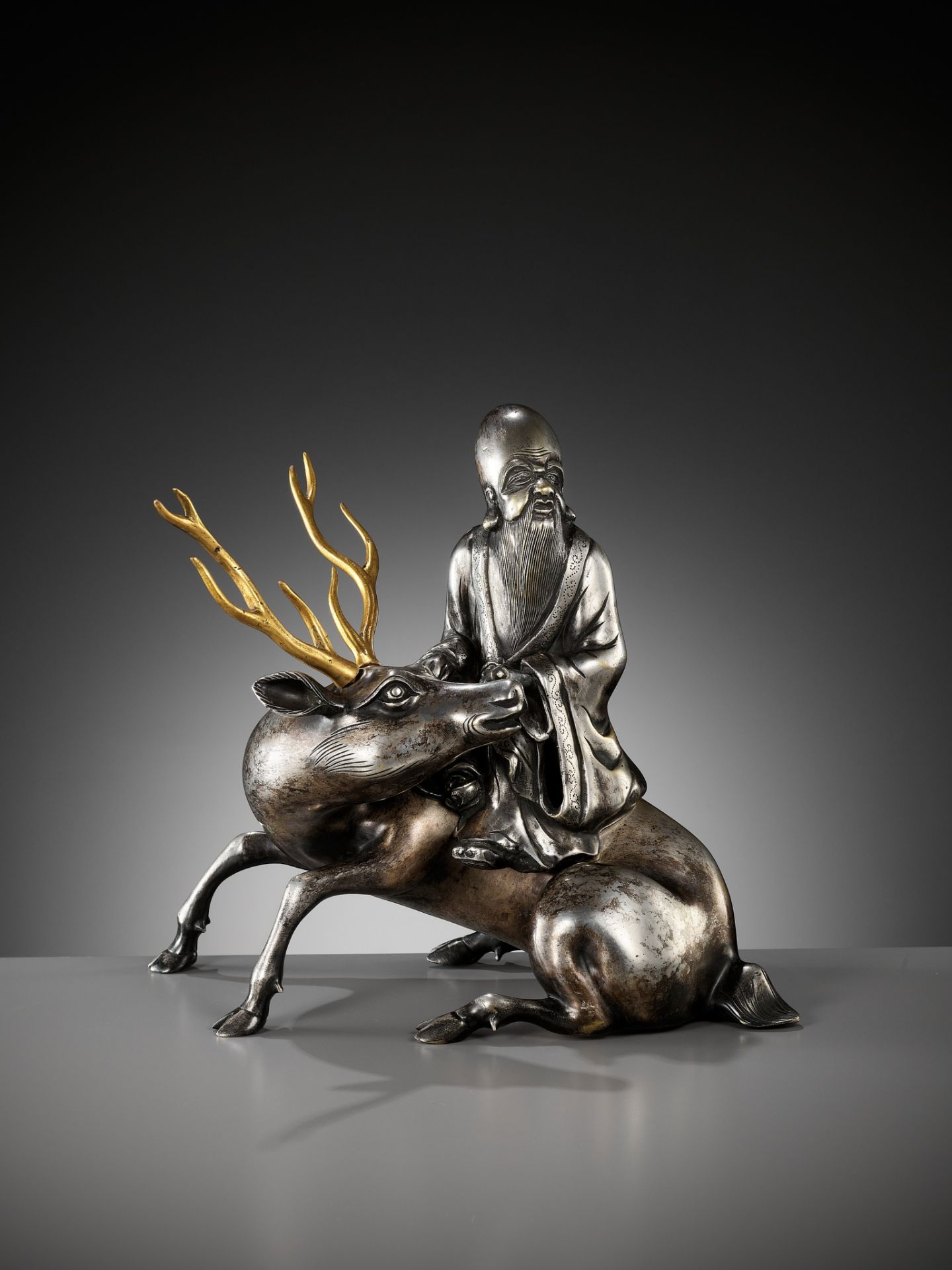 A SILVERED AND GILT BRONZE 'SHOULAO AND DEER' INCENSE BURNER, QING DYNASTY - Image 2 of 14