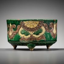 A GREEN, AUBERGINE, AND YELLOW-GLAZED TRIPOD CENSER, LIAO DYNASTY