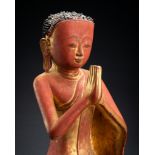A BURMESE LACQUERED PAPER MACHE FIGURE OF A MONK, 18th - 19th CENTURY
