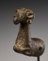 A LURISTAN BRONZE 'RAM' WHETSTONE FINIAL, CIRCA 1000-650 BC