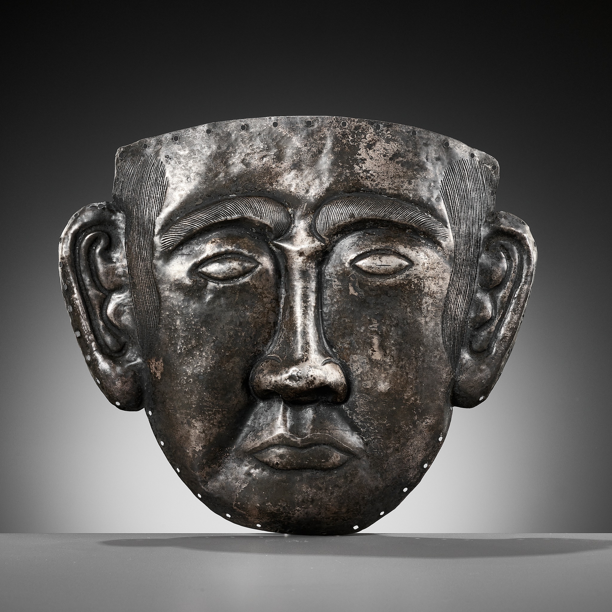 A SILVER FUNERARY MASK OF A NOBLEMAN, LIAO DYNASTY